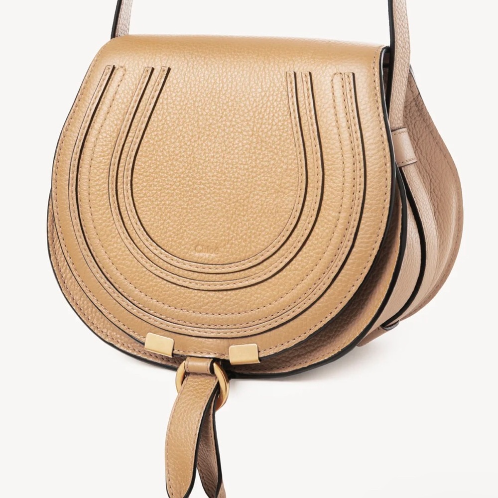 SOLD SOLD Marci Small Saddle Bag ( soft tan) brand new with tag and dust bag